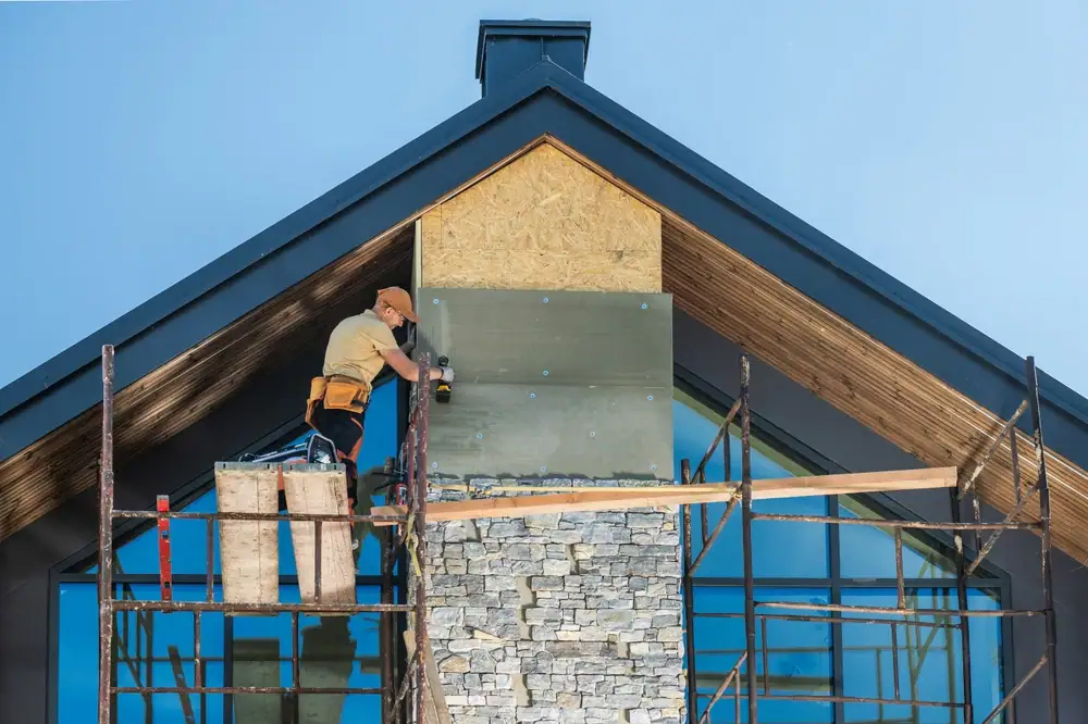 Construction worker on scaffold in Suffolk County, New York, working on a masonry project for Power House Mason Supply