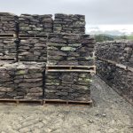 Close-up of Pennsylvania Regular fieldstone in varying natural tones, showcasing its rugged texture and unique shapes, perfect for masonry and landscaping projects from Power House Mason Supply